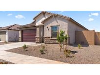 Charming single-story home featuring a two-car garage and desert landscaping for low maintenance appeal at 16620 N Dante Way, Maricopa, AZ 85138