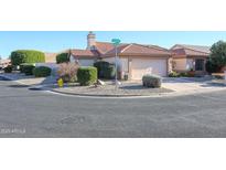 Single-story home with a two-car garage and well-manicured landscaping at 3935 N 151St Ave, Goodyear, AZ 85395