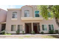 Charming townhome with neutral paint, stylish windows, and front yard landscaping at 500 N Roosevelt Ave # 92, Chandler, AZ 85226