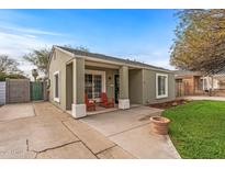 Charming single-story home with a cozy front porch and a well-manicured lawn at 1325 E Monte Vista E Rd, Phoenix, AZ 85006