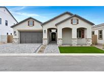 Charming single-story home with a two-car garage, arched entryway, and well-manicured front yard at 3624 N 59Th St, Mesa, AZ 85215