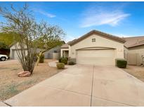 Attractive desert landscape front exterior with driveway and two-car garage at 15732 E Yucca Dr, Fountain Hills, AZ 85268