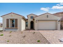 Charming single-story home with desert landscaping, inviting entrance, and a two-car garage at 5845 S Romano --, Mesa, AZ 85212