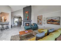 Bright living room featuring a fireplace and comfortable seating at 7777 E 2Nd St # 303, Scottsdale, AZ 85251