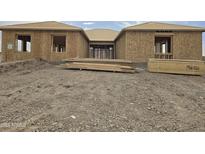 New construction home exterior, showcasing a modern design and desert landscape at 1907 W Brooke Ln, Queen Creek, AZ 85144