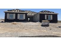 Charming home showing the early construction with dark brick exterior and white window trim at 1907 W Brooke Ln, Queen Creek, AZ 85144