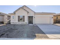 New construction home with two-car garage and front landscaping at 16417 W Desert Mirage Dr, Surprise, AZ 85388