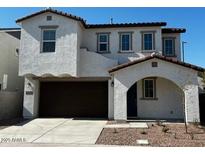 Two-story home with modern design, attached garage, and desert landscaping at 2200 N Iowa St, Chandler, AZ 85225