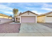 Single-story home with attached garage and desert landscaping at 4723 N 84Th Ln, Phoenix, AZ 85037