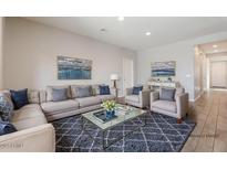 Bright living room featuring plush seating, stylish decor, and an open layout at 8828 S 167Th Ln, Goodyear, AZ 85338