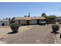 Charming single-story home features a gravel front yard and a convenient carport for covered parking at 925 E Henry St, Tempe, AZ 85288