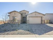 One-story home with stone accents and a two-car garage at 18949 W Ocotillo Rd, Waddell, AZ 85355