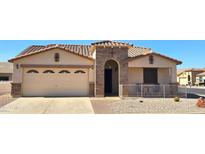 Charming single-story home with a two-car garage, stone accents, and desert landscaping for low maintenance at 2101 S Meridian Rd # 205, Apache Junction, AZ 85120