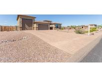 Beautiful single-Gathering home featuring a paver driveway and a three-car garage at 13524 W Sierra Vista Dr, Glendale, AZ 85307