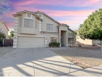 Two-story house with attached garage and landscaped yard at 1342 N Mckenna Ln, Gilbert, AZ 85233