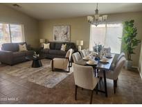 Spacious living room features a large sofa, chair, and coffee table at 2946 E Quiet Hollow Ln, Phoenix, AZ 85024