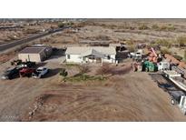 Aerial view of house, large lot, and various outbuildings at 12601 S Hermit Rd, Buckeye, AZ 85326