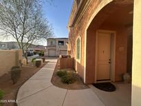 Well-maintained stucco home with walkway and landscaping at 900 S Canal Dr # 204, Chandler, AZ 85225