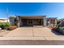 Charming single-story home with covered parking and well-maintained desert landscaping at 215 N Power Rd # 361, Mesa, AZ 85205