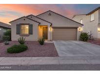 Single-story house with two-car garage, landscaping, and a neutral color scheme at 1078 S 151St Ln, Goodyear, AZ 85338