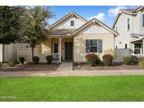 Charming craftsman style home with front porch and well-manicured lawn at 2251 S Annie Ln, Gilbert, AZ 85295