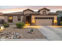 Beautiful single-story home with stone accents and a three-car garage at 10873 E Salt Bush Dr, Scottsdale, AZ 85255