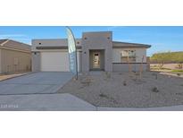 A modern single-story home featuring neutral colors, low maintenance landscaping, and an attached two car garage at 34505 N Timberlake N Mnr, San Tan Valley, AZ 85144