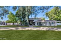 Stunning single-story home with a large front yard and attached garage at 6319 E Mariposa St, Scottsdale, AZ 85251