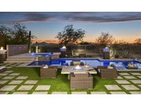 Stunning backyard with a pool, spa, and fire pit, perfect for entertaining at 14146 N 106Th Way, Scottsdale, AZ 85255