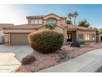 Beautiful two-story home with a landscaped front yard at 16442 N 59Th Pl, Scottsdale, AZ 85254