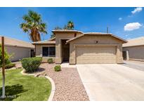 Charming single-Gathering home featuring a well-manicured front yard and a two-car garage at 1778 S Saddle St, Gilbert, AZ 85233