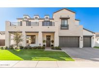 Two-story home with light stone exterior, balcony, and landscaped lawn at 3901 E Sagebrush St, Gilbert, AZ 85296