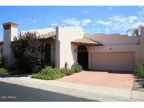 Spanish style home with a two-car garage at 7955 E Chaparral Rd # 103, Scottsdale, AZ 85250