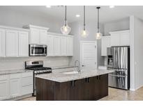 Modern kitchen with granite countertops and stainless steel appliances at 10605 E Monterey Ave, Mesa, AZ 85209