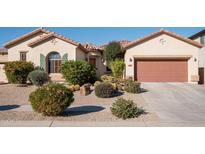 Single-story home with desert landscaping and two-car garage at 2430 W Horsetail Trl, Phoenix, AZ 85085