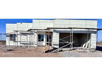 New construction home exterior showcasing modern design at 30502 N 235Th Ln, Wittmann, AZ 85361