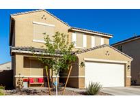 Two-story house with tan exterior, white garage door, and landscaping at 4488 W Charlie Dr, San Tan Valley, AZ 85144