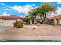 Single-story home with desert landscaping and two-car garage at 9510 E Jadecrest Dr, Sun Lakes, AZ 85248