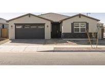 One-story home with a two-car garage, stone accents and landscaping at 17709 W Southgate Ave, Goodyear, AZ 85338