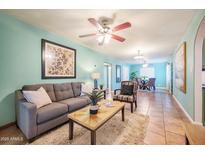 Bright living room featuring hardwood floors and a cozy sitting area at 2021 W Osborn Rd, Phoenix, AZ 85015