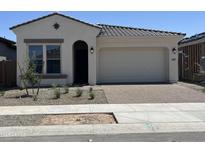 New single-story home with a two-car garage and desert landscaping at 22811 E Stacey Rd, Queen Creek, AZ 85142