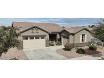 Charming single-story home featuring a three car garage, neutral paint, and beautiful desert landscaping at 20856 E Arroyo Verde Dr, Queen Creek, AZ 85142