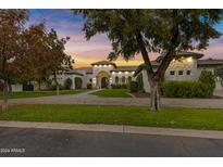 Elegant home with stone accents and a landscaped front yard at 20668 E Sunset Dr, Queen Creek, AZ 85142