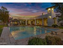 Luxury home with a large inviting pool and spa at 20668 E Sunset Dr, Queen Creek, AZ 85142