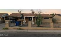 Ranch-style home with carport and fenced yard at 1338 E Elton Ave, Mesa, AZ 85204