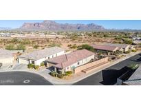 Aerial view of a house with desert landscape and mountain views at 1744 E 16Th Ave, Apache Junction, AZ 85119