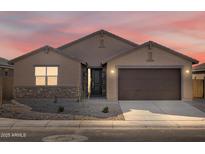 New single-story home with a two-car garage and desert landscaping at 2639 E Santa Ynez Dr, Casa Grande, AZ 85194