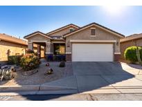 One-story house with desert landscaping and a two-car garage at 31627 N Poncho Ln, San Tan Valley, AZ 85143