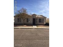 Single-story home with tile roof and landscaping at 8520 W Palm Ln # 1080, Phoenix, AZ 85037