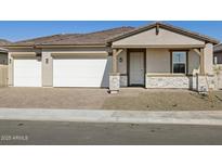 Charming single-story home with a two-car garage and desert landscaping at 17666 W Pierson St, Goodyear, AZ 85395